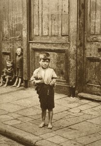Barefoot child on a London street by English Photographer